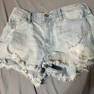 light wash jean shorts with designs on back